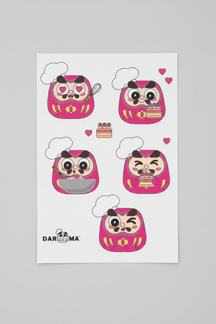 A sheet of five pink Daruma stickers .Our Pastry Chef Andy! The brand logo on the bottom-left corner with white background.